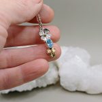 "A természet és védelem szent egysége" - kézzel készült arany, és ezüst amulett topázzal